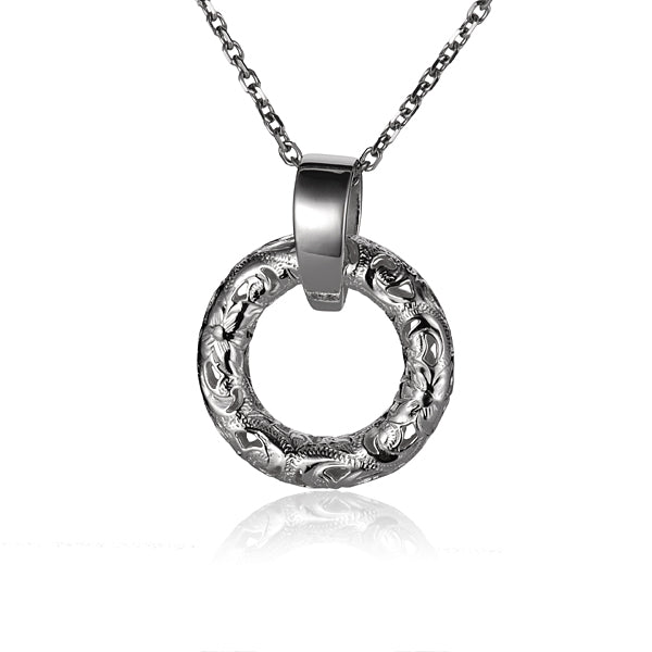 The photo shows a sterling silver circle pendant with a plumeria scroll design.