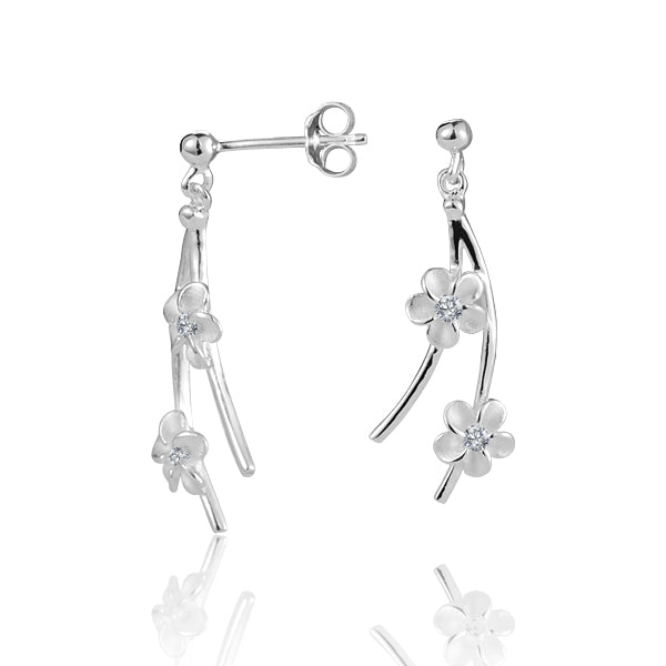 The photo shows a pair of sterling silver featuring a hanging plumeria design with cubic zirconia.