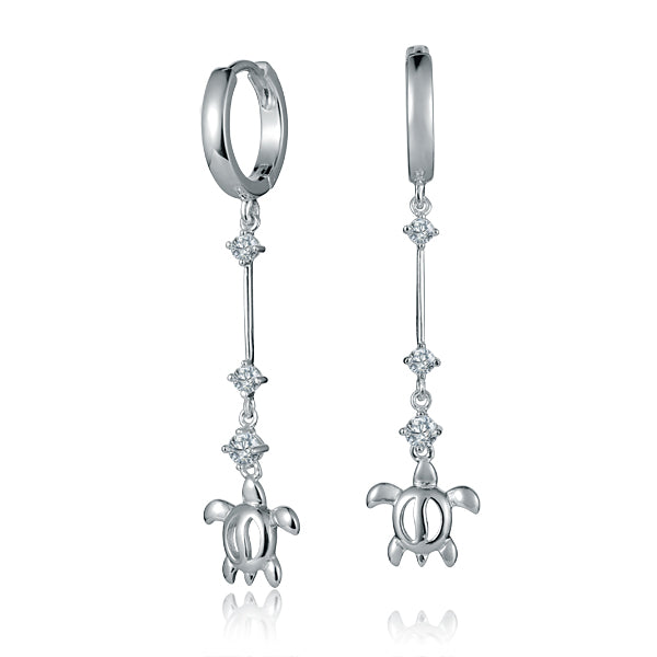 The photo shows a pair of sterling silver sea turtle hoop earrings with a climbing style.