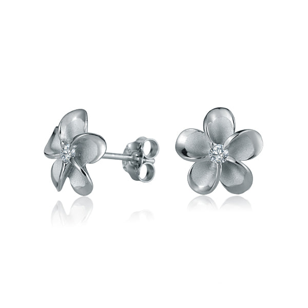 The photo show white gold vermeil sterling silver rhodium plated plumeria flower stud earrings with cubic zirconia gemstones in the center.  