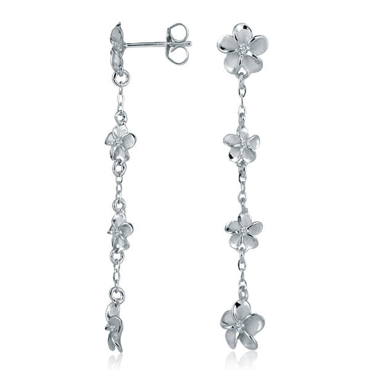 The photo shows a pair of white gold vermeil four plumeria dangle stud earrings with cubic zirconia gemstones.