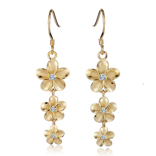 The photo show sterling silver yellow gold vermeil rhodium finish flower hook earrings with cubic zirconia gems.