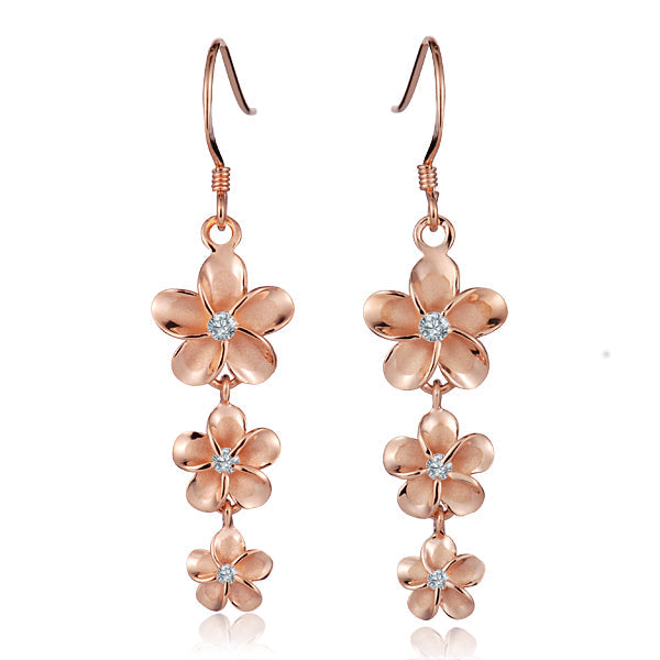 The photo show sterling silver rose gold vermeil rhodium finish flower hook earrings with cubic zirconia gems.