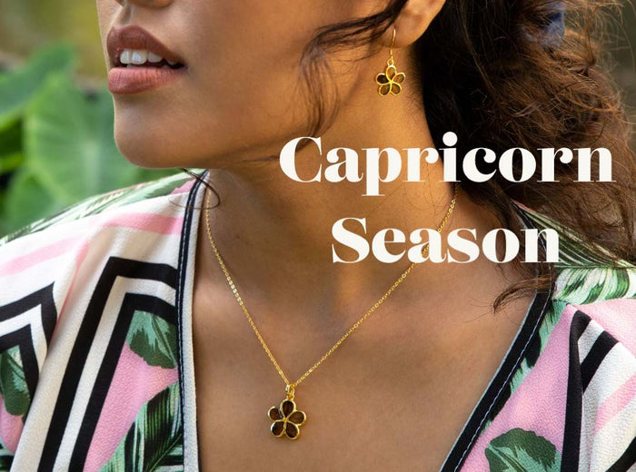 koa wood plumeria pendant in yellow gold for the capricorn season