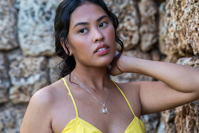 model in a yellow dress wearing Lock and Key Pendant