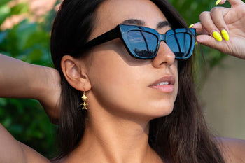 Holiday Gift Guide 2023 featuring plumeria & sea turtle hook earrings in yellow gold setting