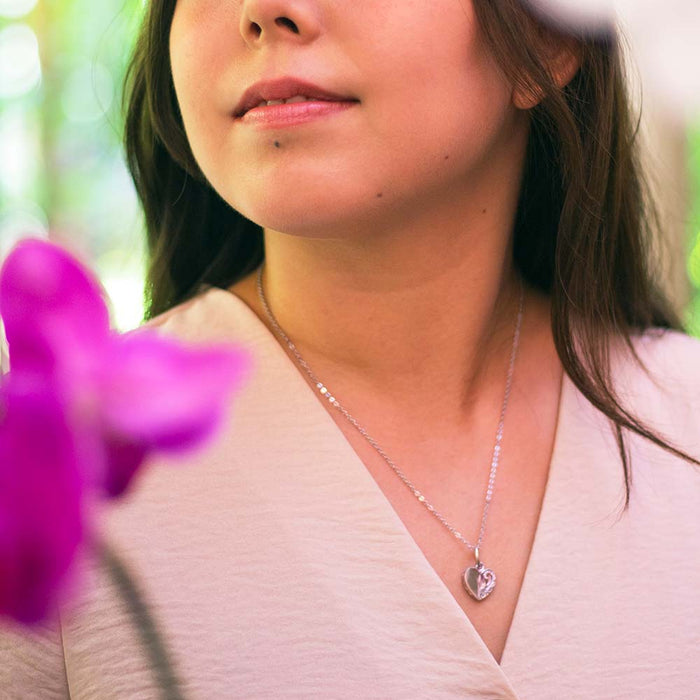 Heart pendant worn by a model