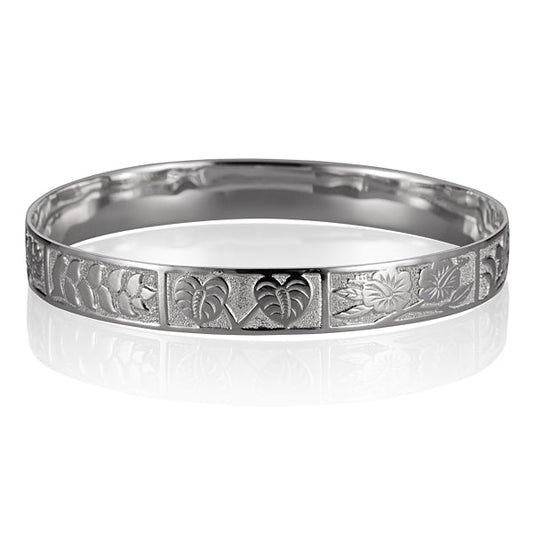 The photo shows a sterling silver bangle featuring a tropical design. 