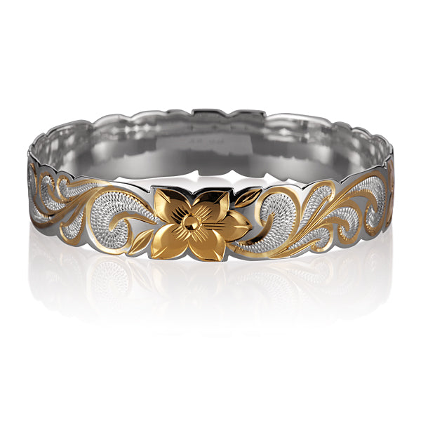 The picture shows a sterling silver yellow gold vermeil Hawaiian flower scroll bangle. 