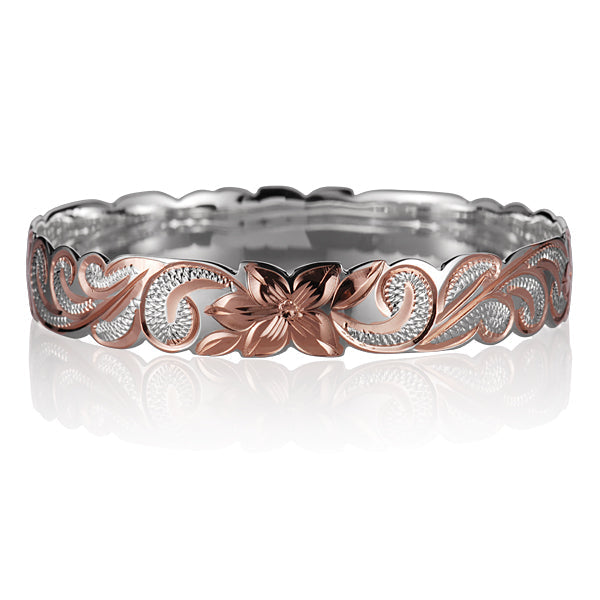The photo is a sterling silver rose gold vermeil Hawaiian flower scroll bangle. 