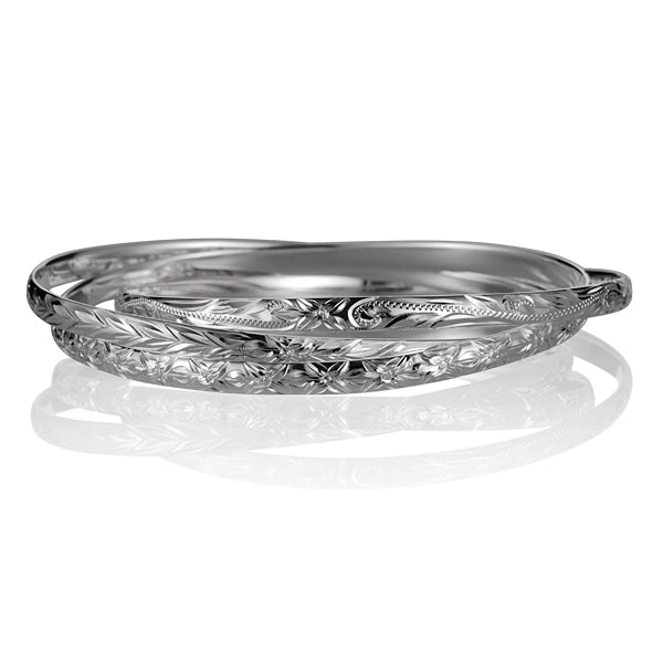 The photo shows a sterling silver bangle featuring a 3 in 1 design. 
