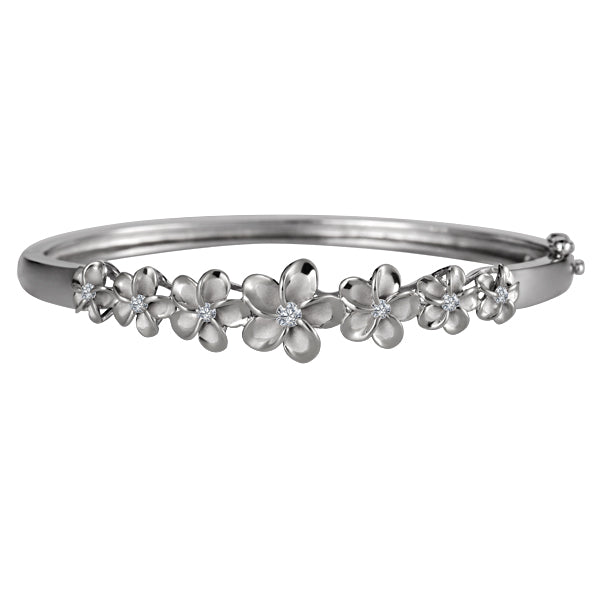 The picture is a two-tone sterling silver rhodium plated and white gold vermeil plumeria bangle with cubic zirconia. 