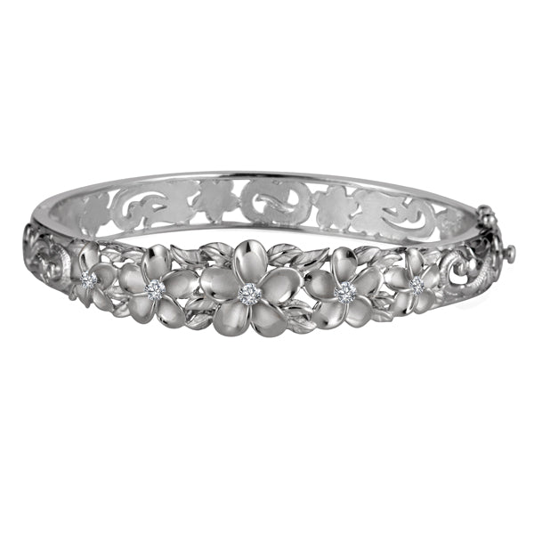 The picture is a sterling silver rhodium plated white gold vermeil plumeria bangle with cubic zirconia stones. 