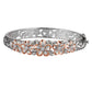 The picture is a two-tone white and rose gold vermeil plumeria bangle with cubic zirconia. 