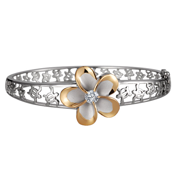 The photo shows a yellow gold vermeil sterling silver rhodium plated plumeria flower bangle featuring sea turtles and cubic zirconia gems.  