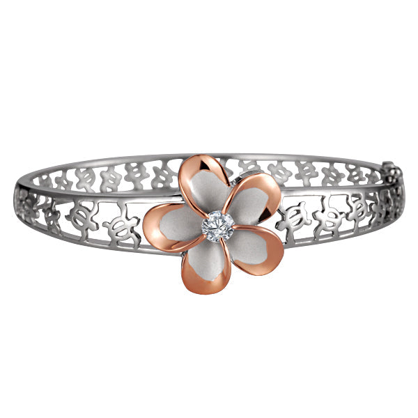 The photo shows a rose gold vermeil sterling silver rhodium plated plumeria flower bangle featuring sea turtles and cubic zirconia stones.  