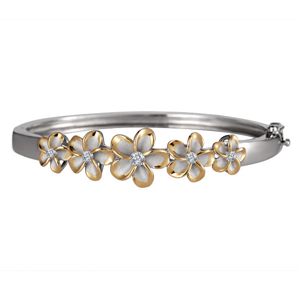 The photo is a sterling silver bangle with yellow gold vermeil rhodium plated plumerias and cubic zirconia. 