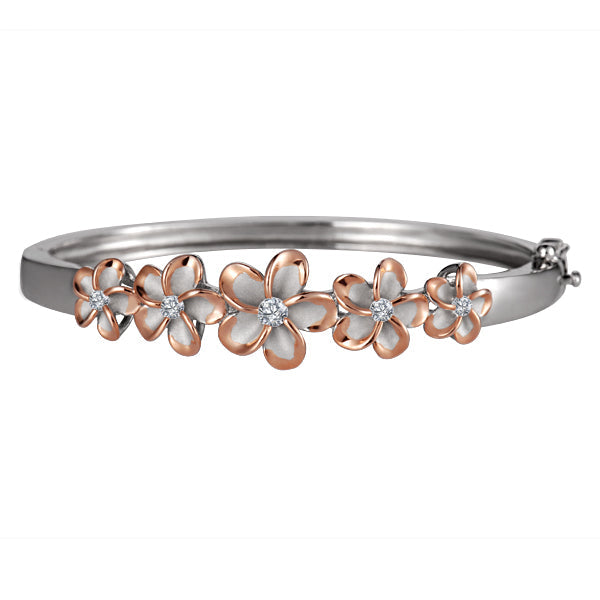 The photo is a sterling silver bangle with rose gold vermeil rhodium plated plumerias and cubic zirconia. 