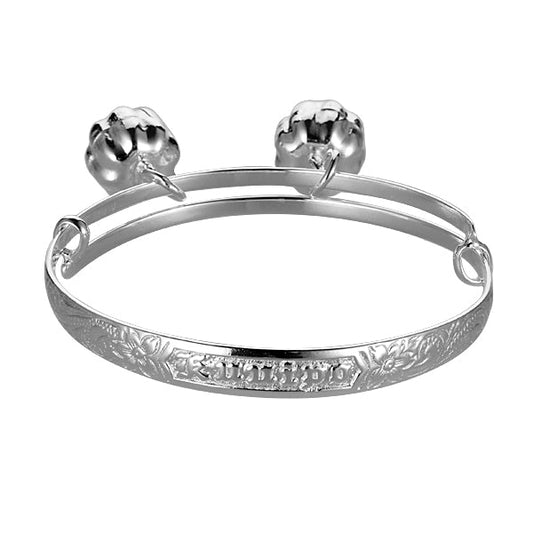 The photo is a sterling silver baby scroll bangle with 2 bells and the Hawaiian word ku'uipo engraved on it.