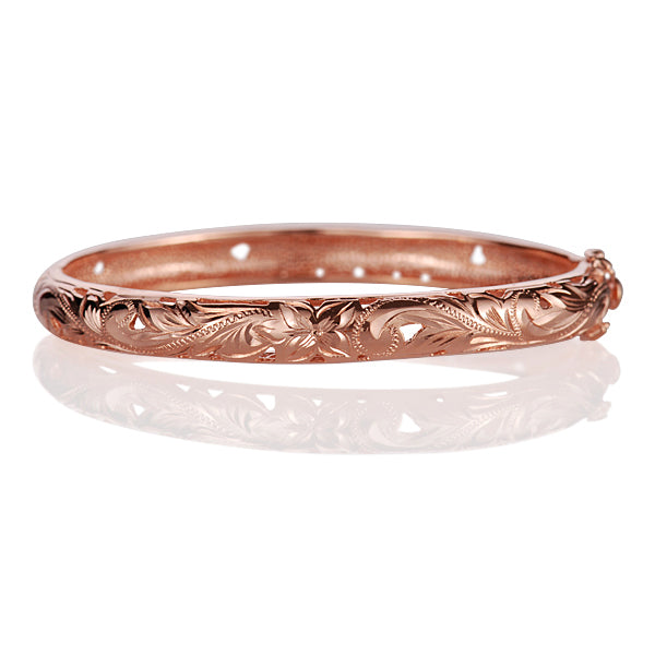 The picture shows a rose gold vermeil scroll oval open bangle. 