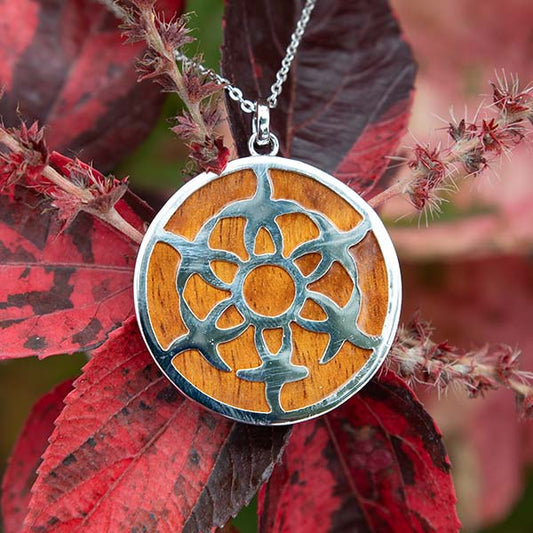 Sterling silver and Koa wood Circle pendant. Five starfish standing around a circle is designed into the Koa wood. 
