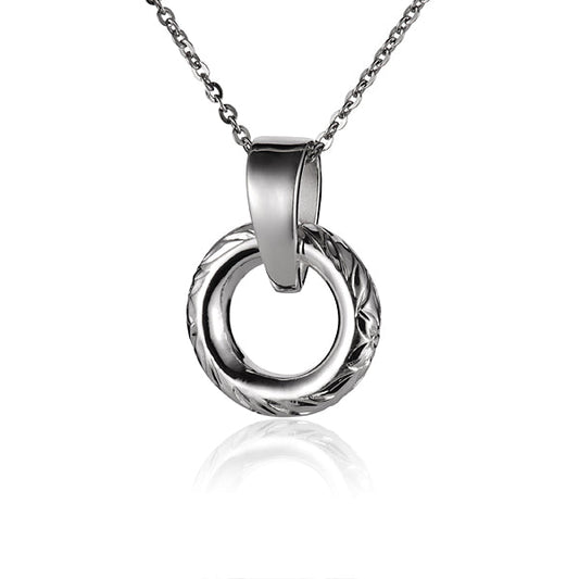 The picture shows a small white gold vermeil round circle engraved pendant. 