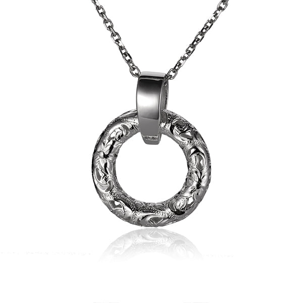 The photo shows a sterling silver circle pendant with a plumeria scroll design. 