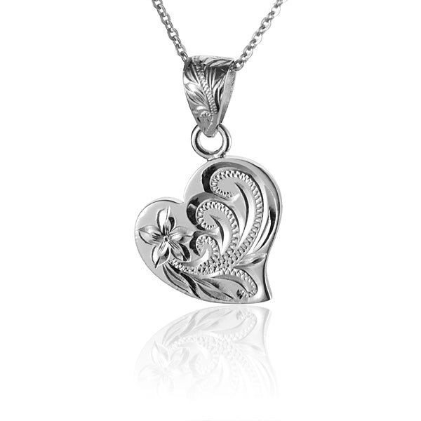 The photo shows a sterling silver scroll plumeria heart pendant. 