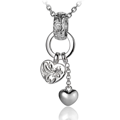 The picture shows a white gold vermeil scroll bell two heart pendant.