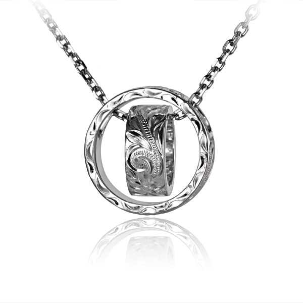 The photo is a white gold vermeil scroll circle pendant featuring a ring design. 