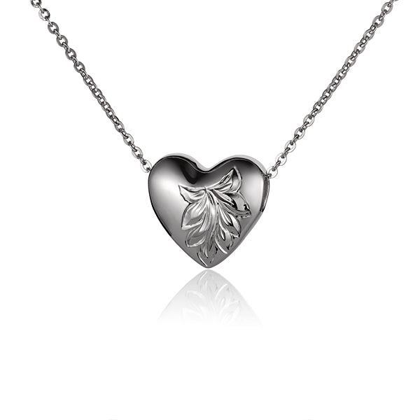 The photo shows a sterling silver oval scroll heart pendant.
