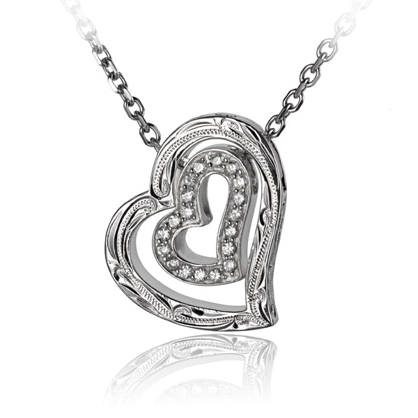 The photo shows a 925 sterling silver scroll heart pendant featuring clear eco-gems. 