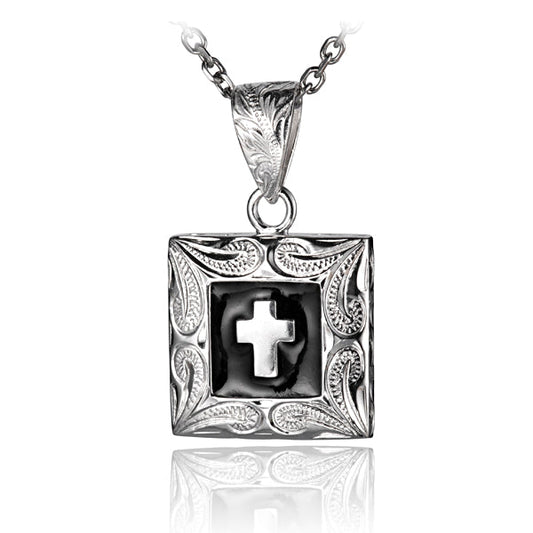 The photo shows a sterling silver cross black square pendant with a scroll motif on the corners. 
