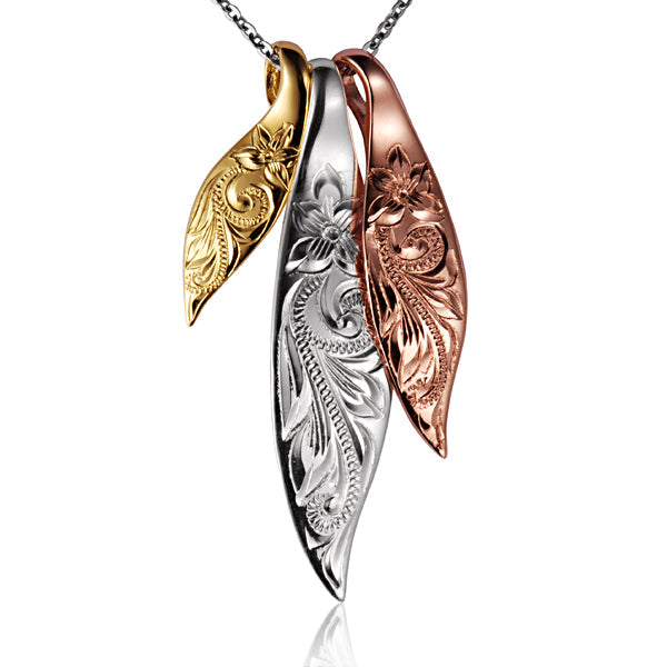 The picture is a three-tone 3-in-1 sterling silver, yellow, rose gold vermeil leave pendant with a plumeria scroll engraving. 