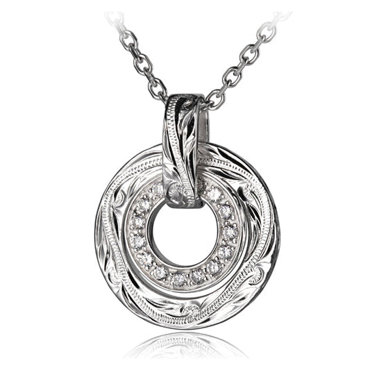 The photo shows a sterling silver ring scroll pendant with cubic zirconia.