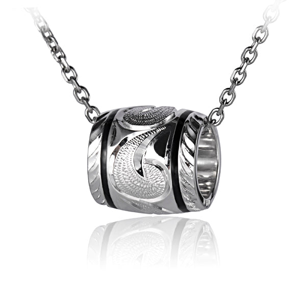 The picture shows a sterling silver engraving barrel pendant in a medium size. 