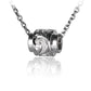 The picture shows a sterling silver raised scroll barrel pendant.