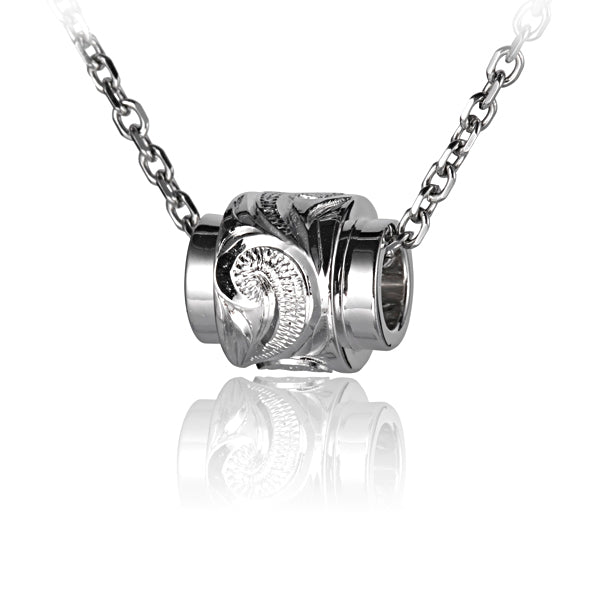The picture shows a sterling silver raised scroll barrel pendant.