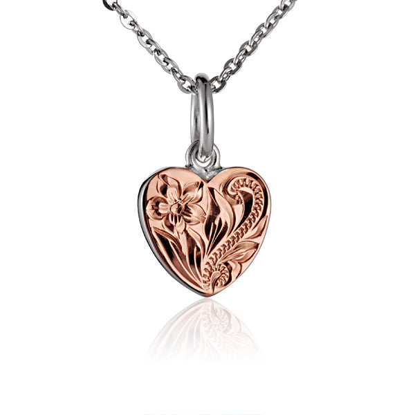 The photo is a two-tone white and rose gold vermeil small scroll heart pendant.