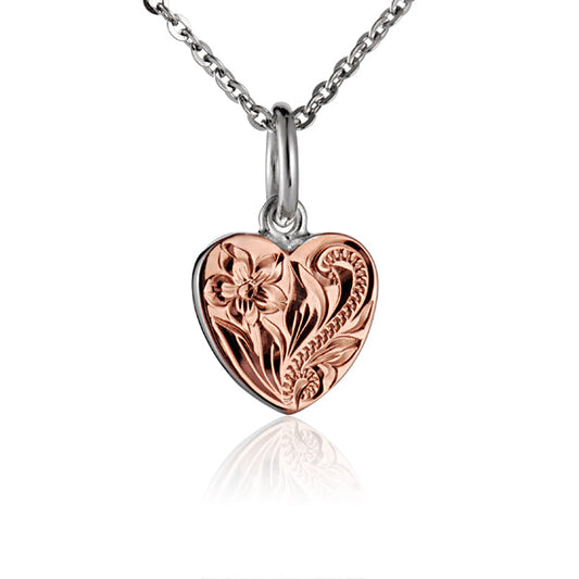 The photo is a two-tone white and rose gold vermeil small scroll heart pendant.