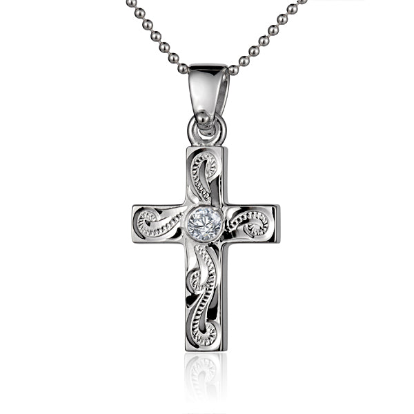 The photo shows a sterling silver scroll cross pendant with cubic zirconia.