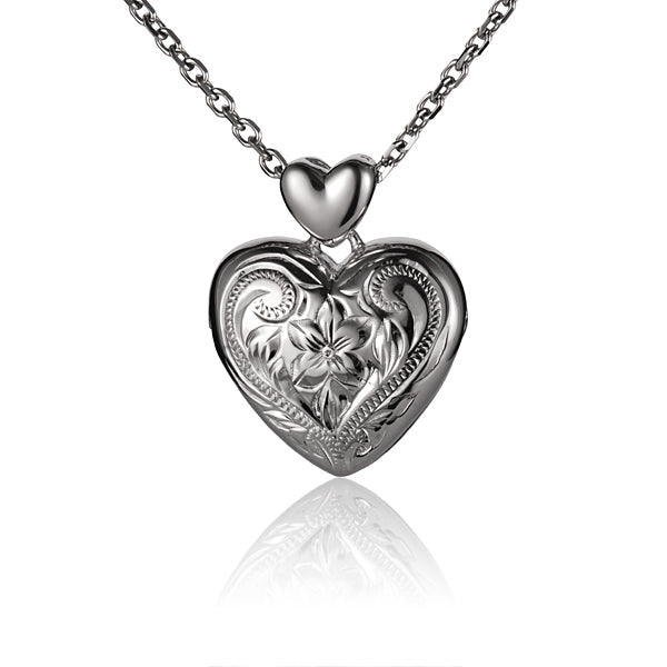 The picture shows a sterling silver large locket pendant with a scroll plumeria engraving.