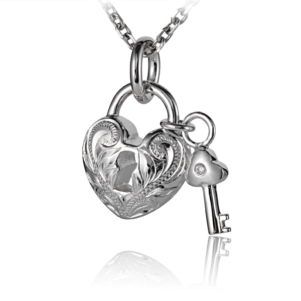 The picture shows a white gold vermeil scroll heart with key pendant.