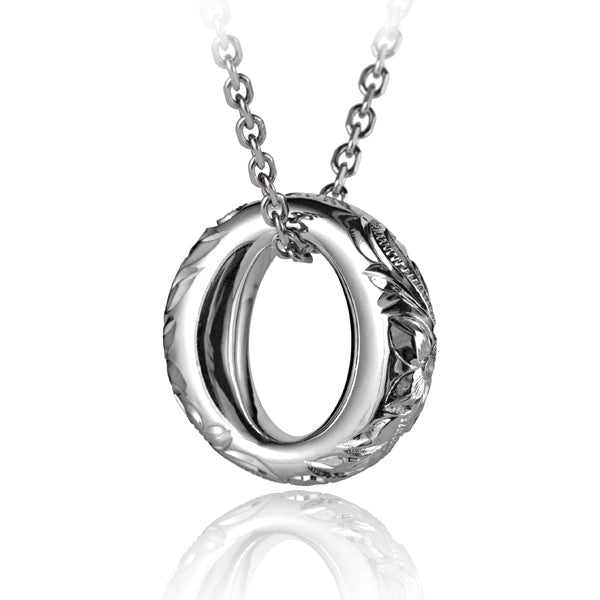 The photo shows a sterling silver circle pendant with a hand-made Hawaiian engraved.