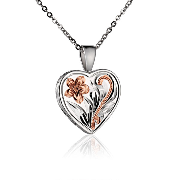 The photo shows a two-tone white and rose gold vermeil scroll heart pendant. 
