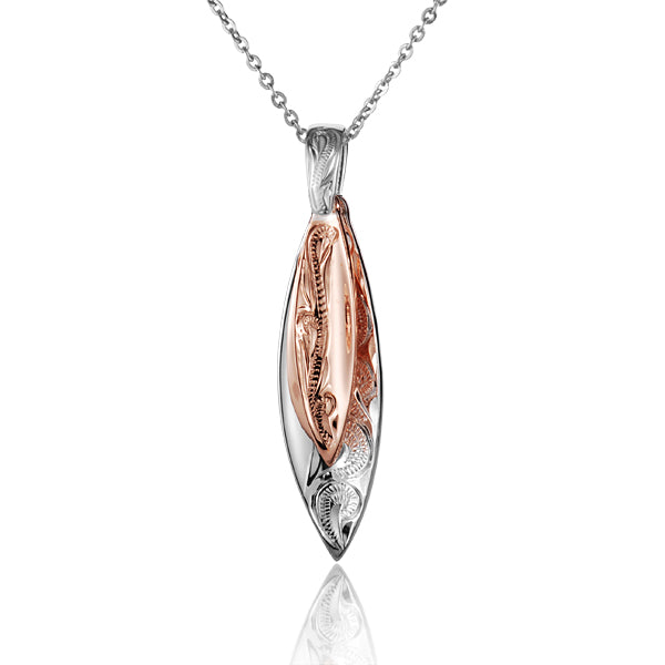 The picture shows a two-tone white and rose gold vermeil scroll double surfboard pendant. 