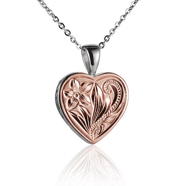 The photo shows a two-tone white and rose gold vermeil scroll heart pendant. 
