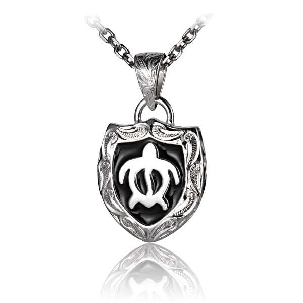 The photo shows a sterling silver sea turtle crest pendant.