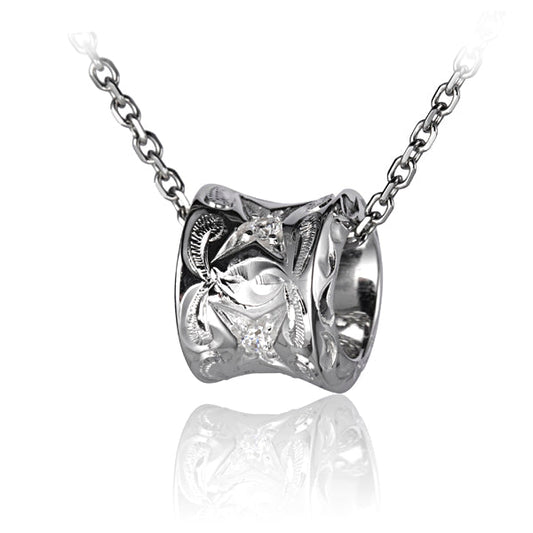 The photo shows a sterling silver barrel pendant with a scroll motif with cubic zirconia.