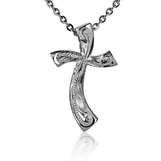 The photo is a sterling silver cross pendant with a scroll motif engraved. 